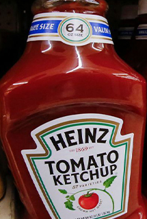 Heinz Ketchup bottles on a shelf in a grocery store