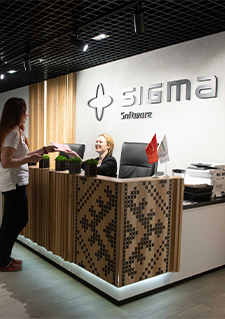 Photo of a person at the reception desk of a Sigma Software office