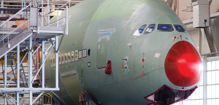 Photo of a large aircraft in a hangar
