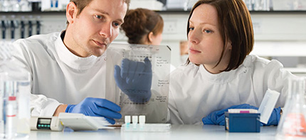 Photo of two technicians working in a laboratory