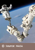 Photo of an astronaut in space at the end of Canadarm2, courtesy of NASA